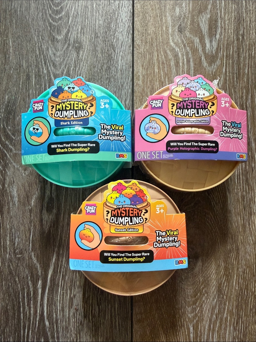Mystery Dumpling Kids Toy - Shark, Purple Holographic, and Sunset Editions
